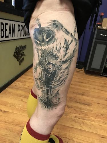 Work by Electric Quill Tattoos