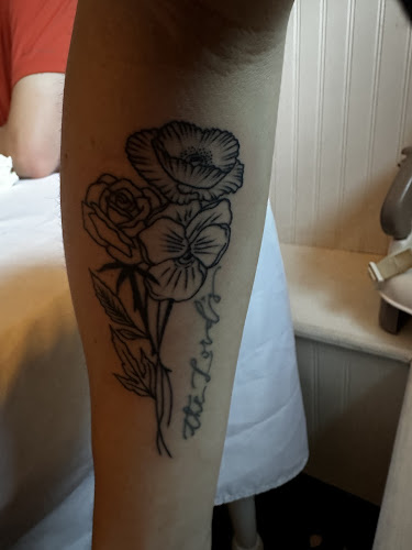 Work by Promised Land Tattoo and Piercing