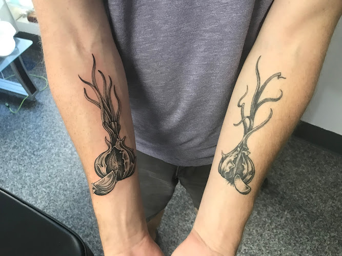 Work by 7th Sloth tattoo