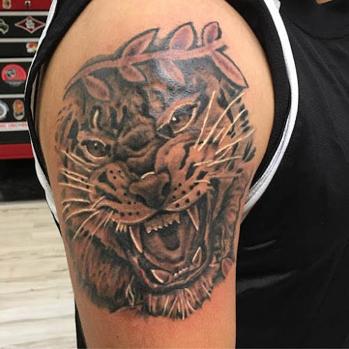 Work by Black Water Tattoo And Design