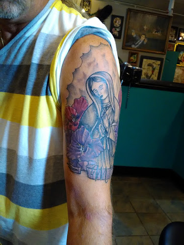 Work by Enigma Tattoos & Body Piercings