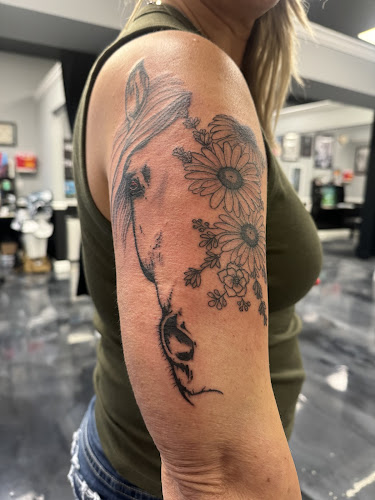 Work by Ringo Pinion Tattoo and Pinup Studio