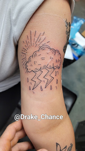 Work by Striking Irons Tattoo Shop