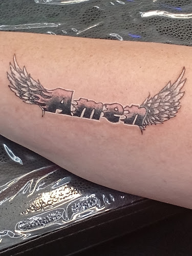 Work by Tiger's Eye Tattoo and Piercing