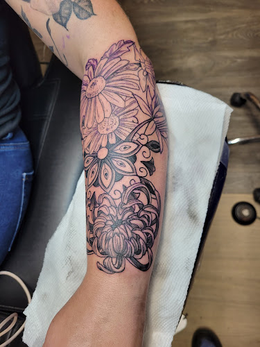 Work by Friki Tiki Tattoo and Gallery
