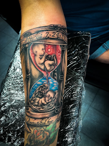 Work by Status Tattoo