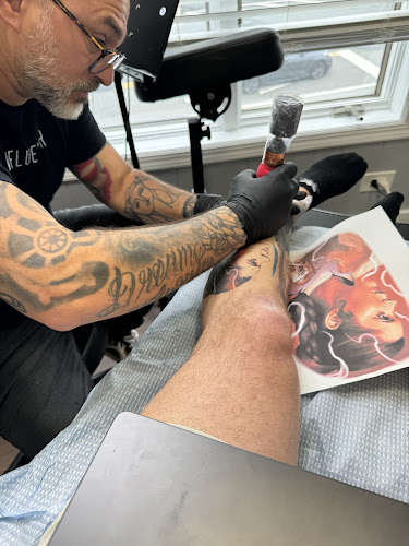 Work by Lighthouse Tattoo Parlor