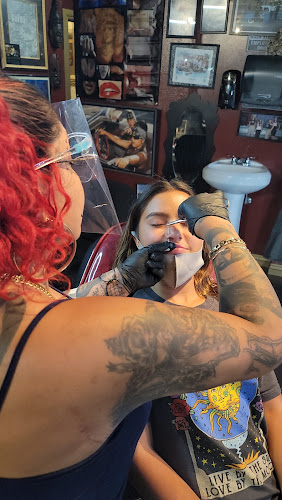 Work by Uptown Tattoos & Piercing