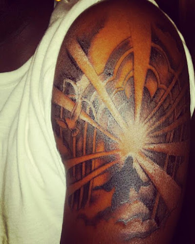 Work by Sacred Flame Tattooing & Body