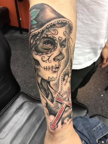 Work by Unholy Grail Tattoo Inc