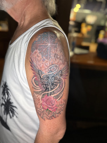 Work by Scarecrow Galleries Tattoo Company